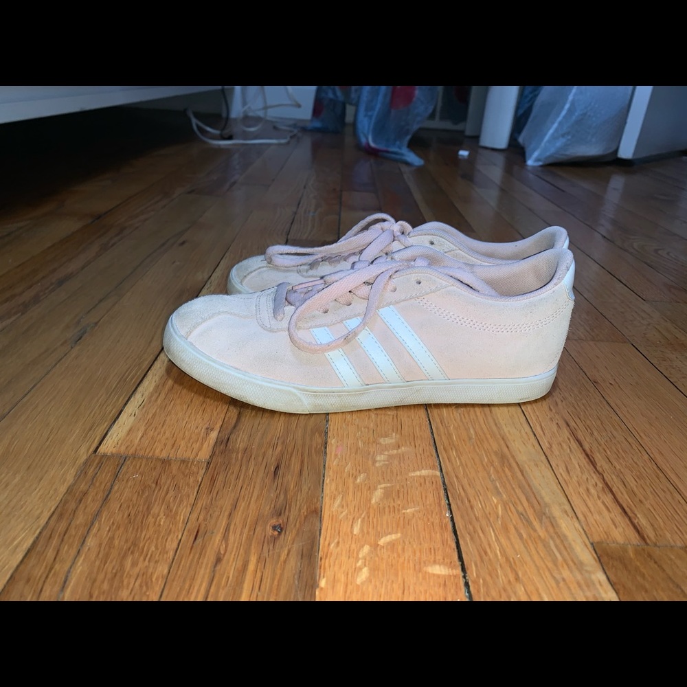 Light pink adidas sneakers.